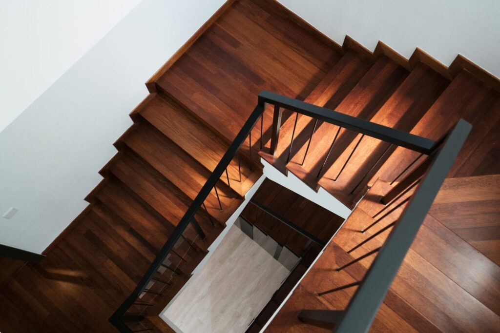 Modern solid dark brown wooden stairs in new house