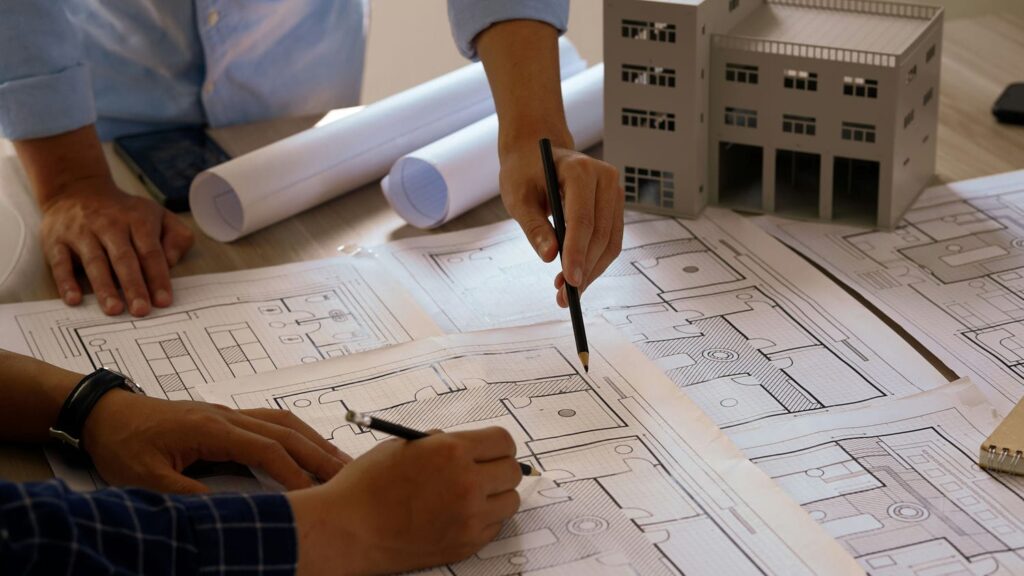 builders reviewing home plans