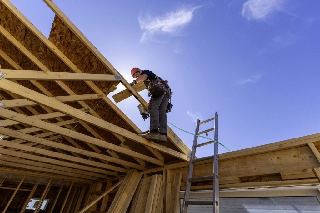 carpentry subcontractor working on roof
