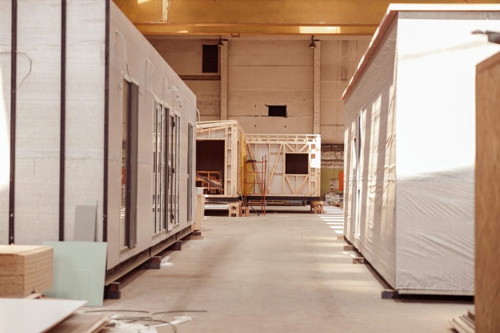 Modular home modules being built inside a factory representing off-site modular construction methodology