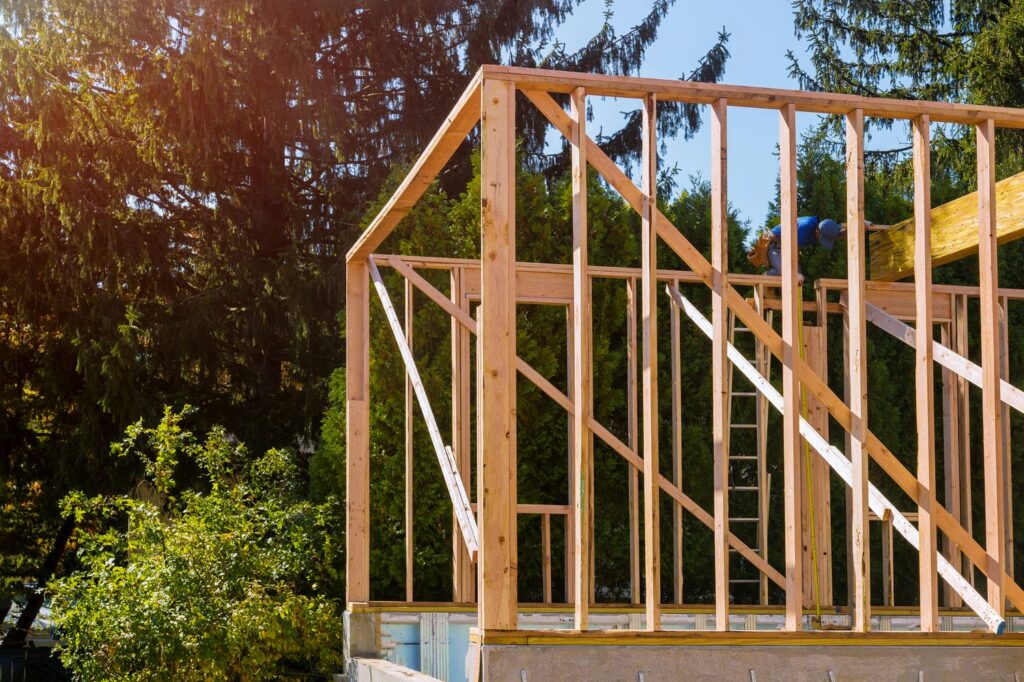 Wood-framed custom home with proper diagonal bracing on a Lower Mainland lot representing accurate square framing