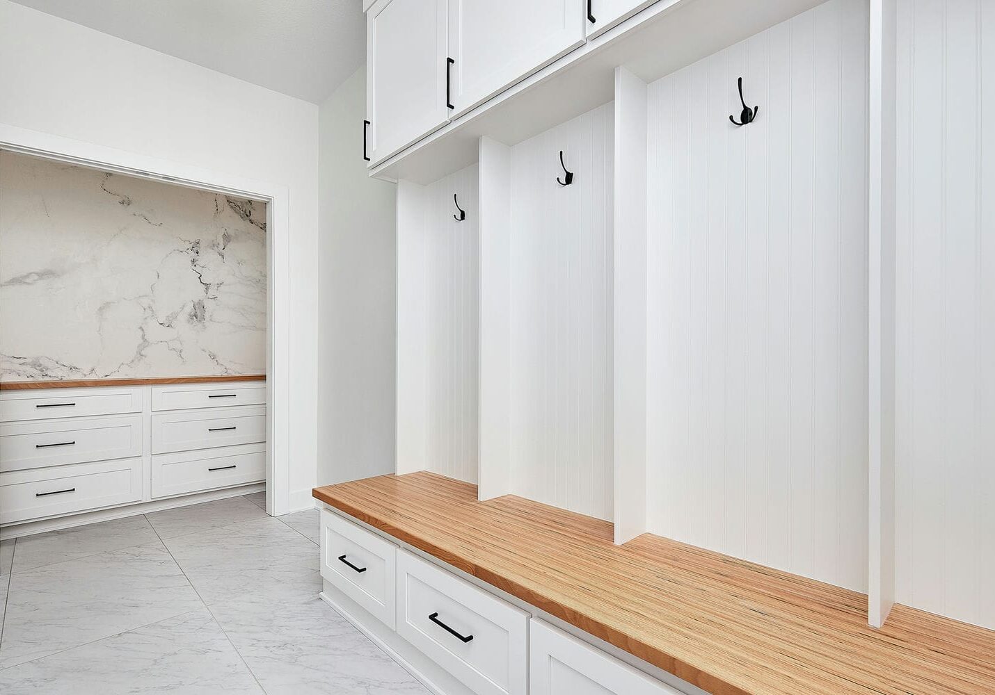 custom mudroom storage and bench built with interior finishing carpentry