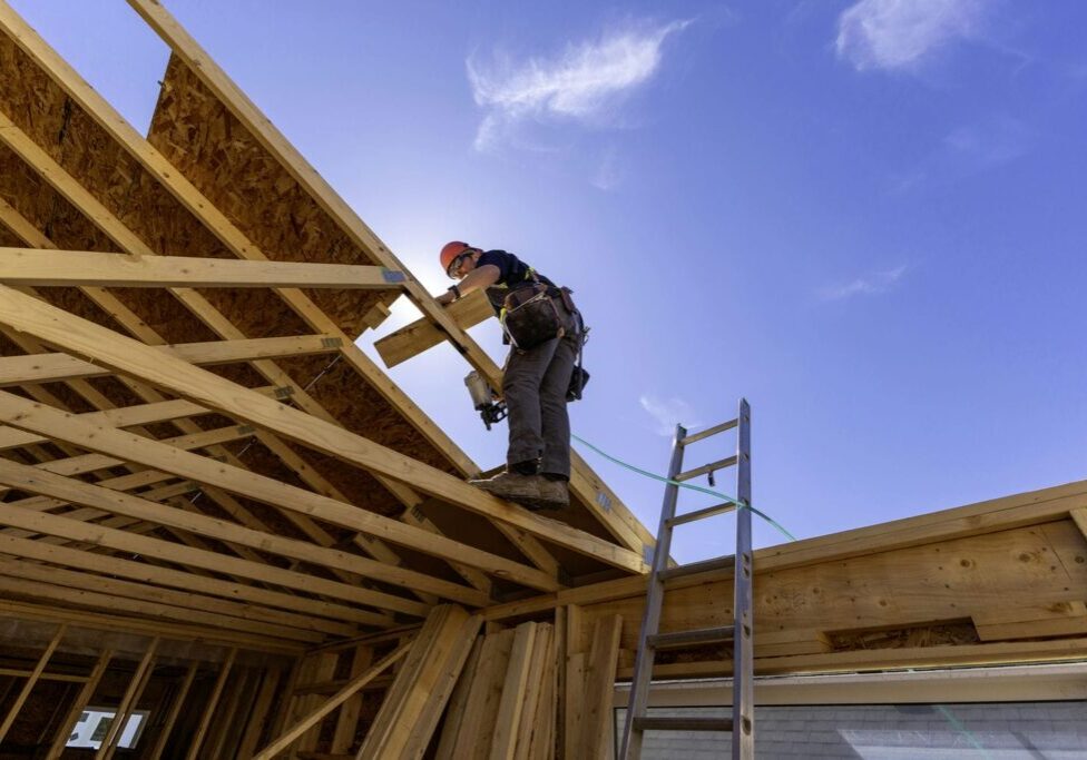 carpentry subcontractor working on roof