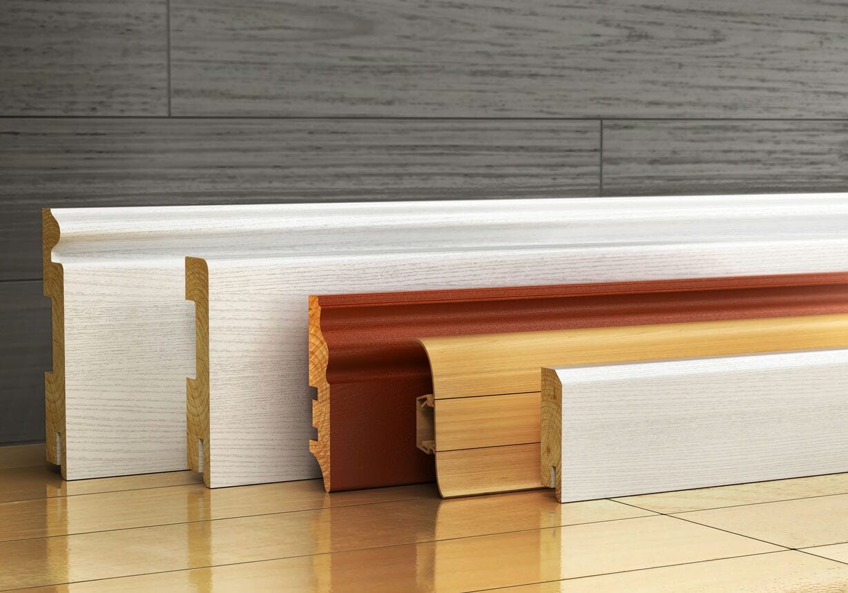 interior finishing carpentry showing baseboard trim and moulding installation
